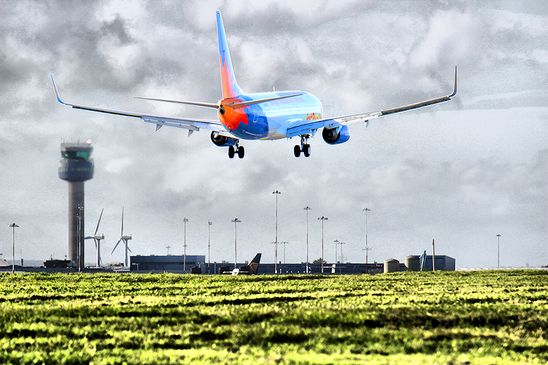 Plane landing at East Midlands Airport, England, UK